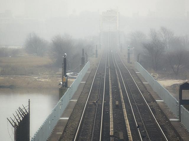 A view of densely Foggy Railway Bridge